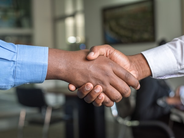 Business partnership handshake